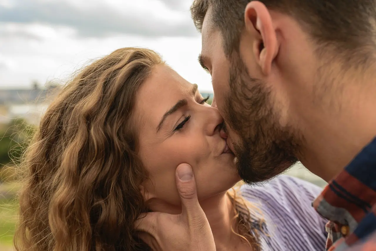 a man and a woman kissing