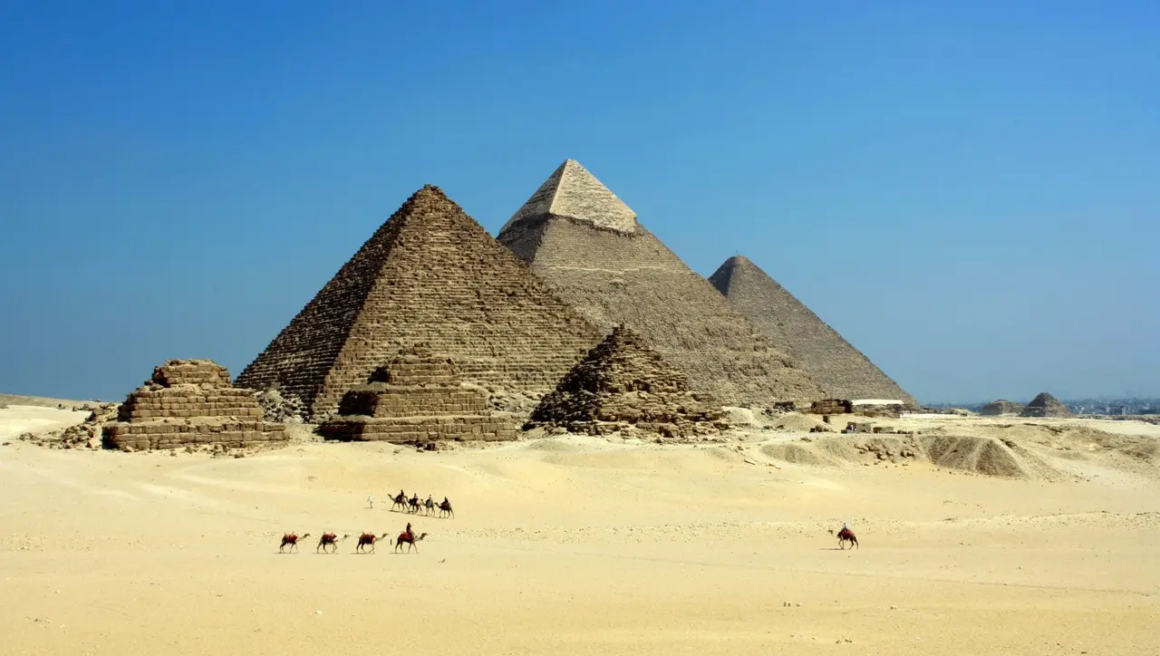 sand, pyramids and some camels of Egypt